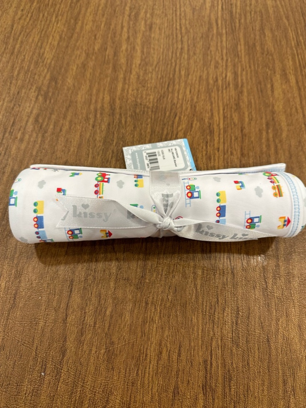 Kissy Kissy White Baby Blanket with Colorful Train Motif